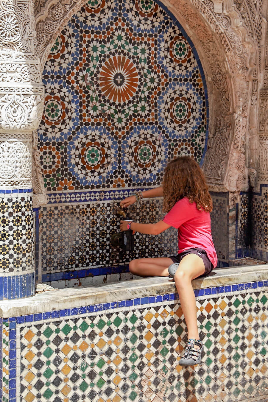 A child fills a LifeStraw water bottle in Morocco