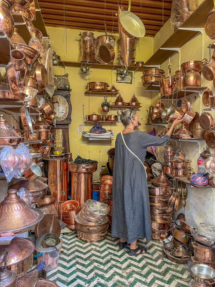 Shopping for copper in Seffarine Square in the Fes Medina on a guided walking tour.