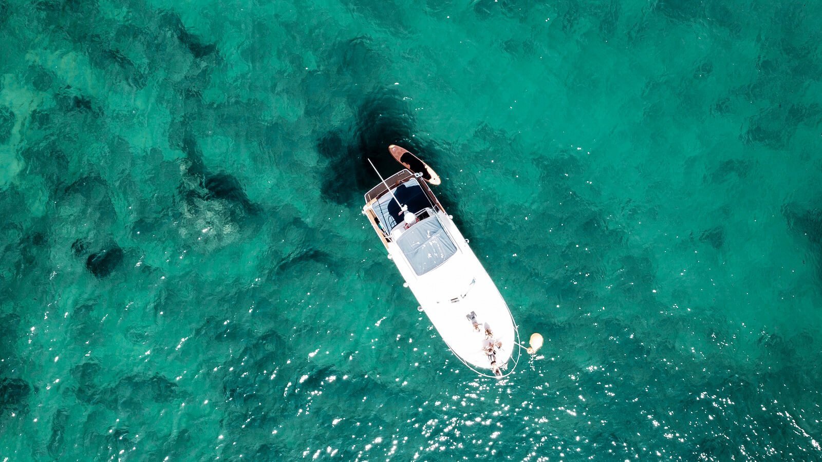 A drone image of a boat moored in the Mediterranean in Javea - one of the best vacation spots in Spain
