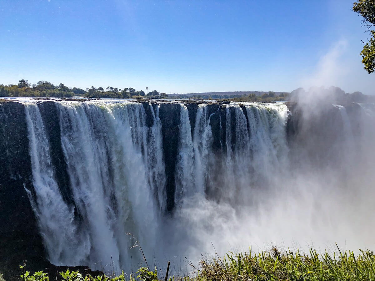 Water falls over the impressive Victoria Falls, seen from the Zimbabwe side.