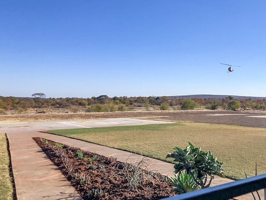 A helicopter approached the helipad in Zimbabwe after returning from a paid flight.
