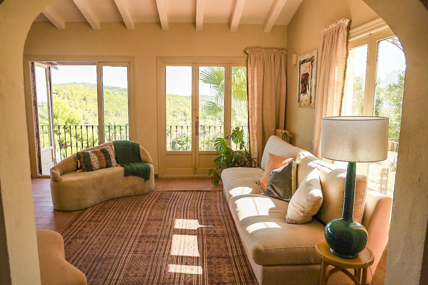 The living space at Villa Riu Blanc with cream furnishings and views of a beautiful Costa Blanca countryside