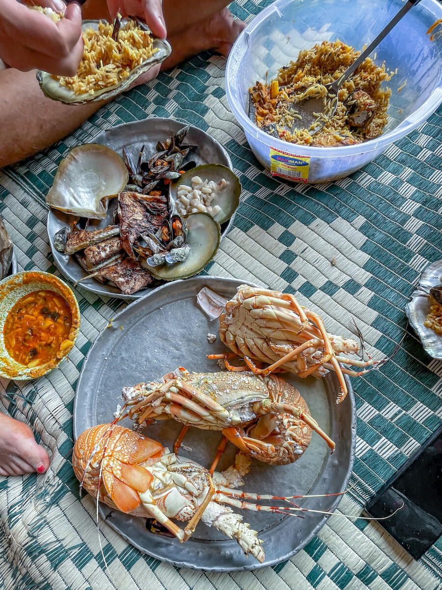 Food prepared on the floor in the cave man's cave in the Detwah Lagoon