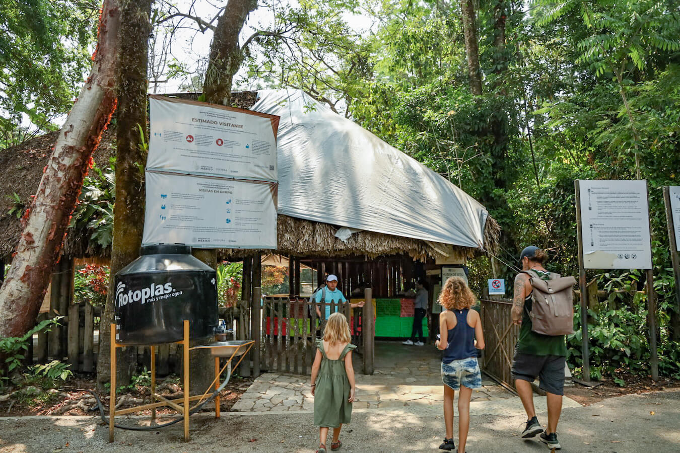 Farther and his two daughters walking towards the main entrance of Palenques ruins. Starting their self guided tour.