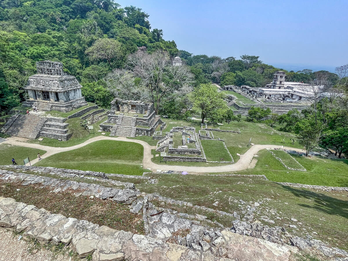 View from the Temple of the Cross looking down onto the Temple of the Sun and out to the Palace at Palenque.