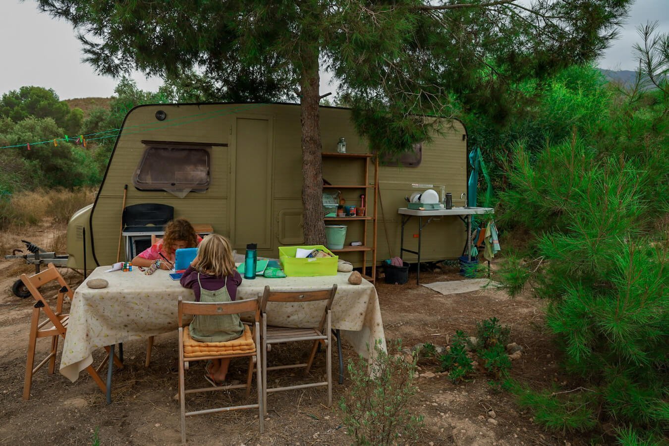 Children do their worldschooling outdoors in Spain.