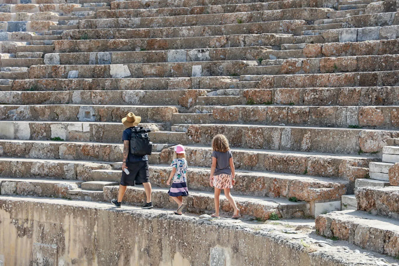 Full-time world travel family walk amphitheater through Turkey