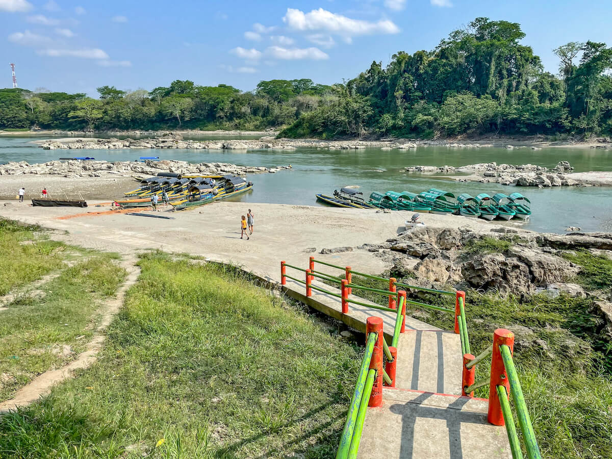 Long boats waiting on the Usumacinta river to take tours down to Yaxchilán ruins.