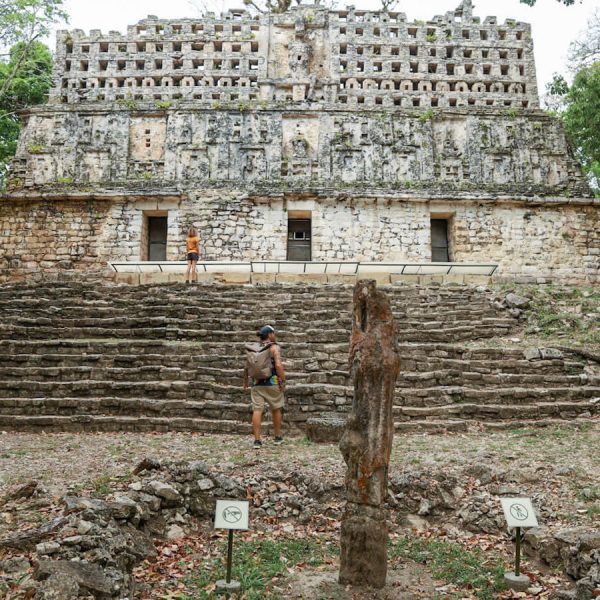 Father and daughter walking up the steps of Structure 33 in Yaxchilán on a 3 day tour of the Lacandon Jungle and Bonampak ruins.