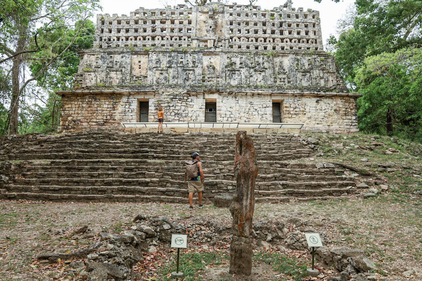 Father and daughter walking up the steps of Structure 33 in Yaxchilán on a 3 day tour of the Lacandon Jungle and Bonampak ruins.