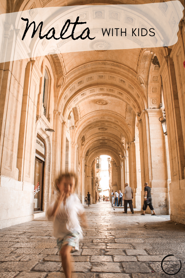 Child runs through the streets in Valletta, Malta